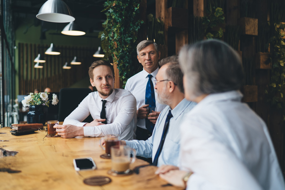 Sydney Tax Accountants sitting in a cafe discussing tax optimisation strategies